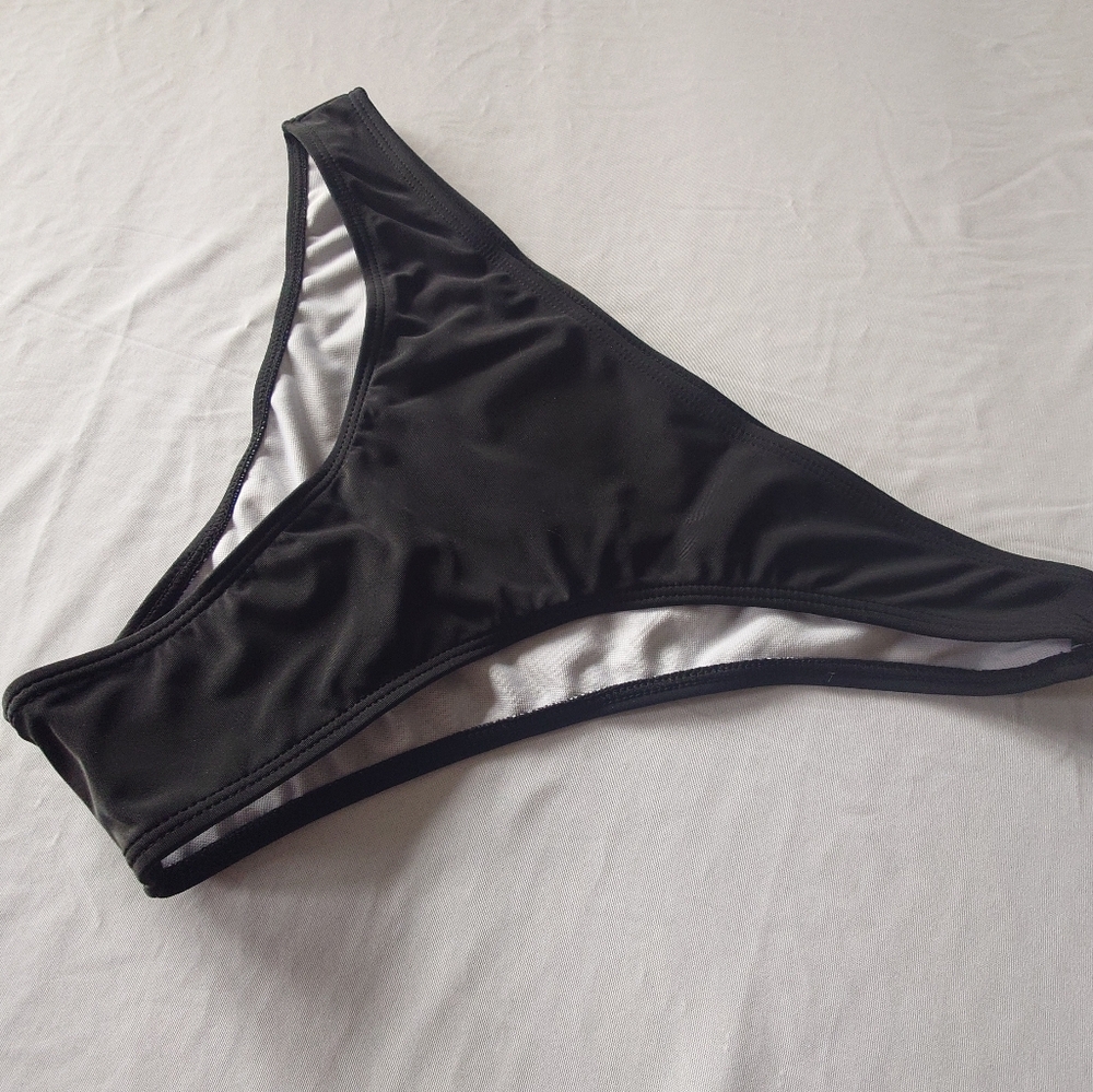Bikini bottom size large. Black. New with hygiene strip attached.